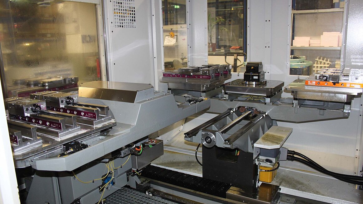 the interior of the 3-fold pallet changing system with different clamping fixtures